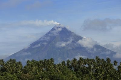 Rescuers climb Philippine volcano to reach plane crash site