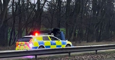 Two Edinburgh people rushed to hospital after car flips on busy road