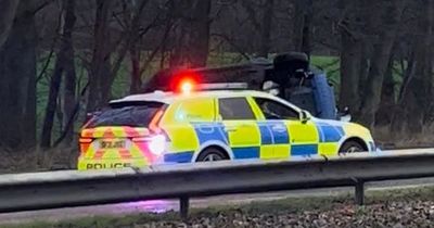 Two pensioners rushed to hospital after car flips on busy Edinburgh road