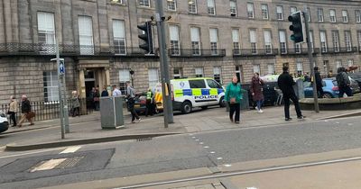 Two cops injured as man charged over alleged attack on busy Scots street