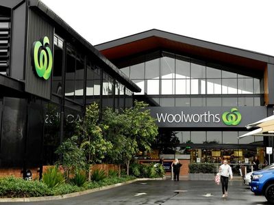 Woolworths half-year profit jumps, lifts dividend