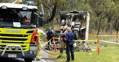 Truck rolls over on Mugga Lane, starts grass fire