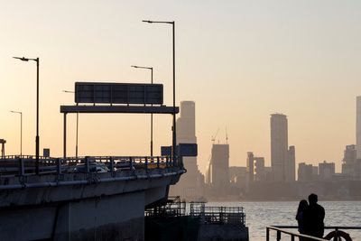 Hong Kong hands out cash, cuts duties in budget despite larger deficit