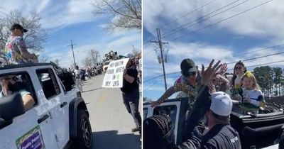 Dustin Poirier slaps UFC fan at parade who mocked his wife with Conor McGregor sign