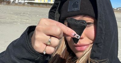 Woman finds bizarre GIANT tooth from 20ft shark in fascinating discovery on beach