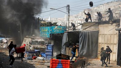 At least 11 Palestinians including gunmen and civilians killed during Israeli raid on West Bank city of Nablus, more than 100 wounded