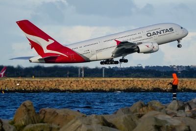 Qantas back in black with $978 million half-year profit