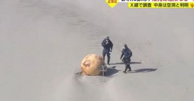 'Mystery sphere' washes up on Japan beach sparking investigation by baffled officials