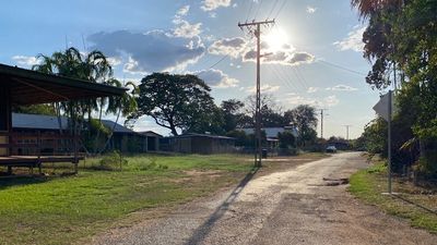 NT Police charge two men after axe allegedly thrown at police car during unrest in Nauiyu