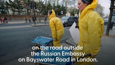 Protest group paints Ukrainian flag outside Russian embassy in London