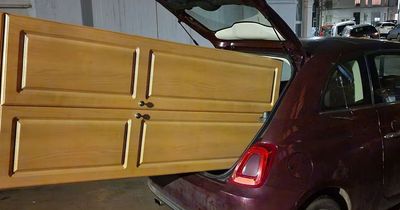 Police stop man driving with wardrobe hanging out of the back of Fiat 500