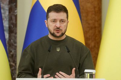 Ukraine's Zelenskiy fights back tears for dead on war anniversary