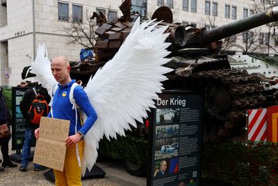 German peace activists park rusty tank outside Russian embassy