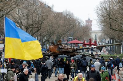 Tank wreck, protests mark Ukraine war anniversary in Europe