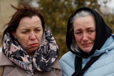 In Ukraine's Bucha where civilians slain, neighbours united in grief