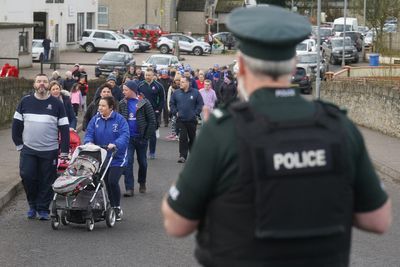 Football club leads solidarity march for shot PSNI officer