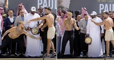 Jake Paul tries to pull down Tommy Fury's shorts during heated weigh-in