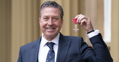 John Torode beams with joy as he receives MBE from Prince William at Buckingham Palace