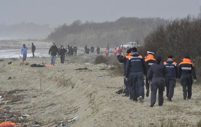 Dozens, including children, drown after refugee ship breaks apart in rough seas off Italian coast