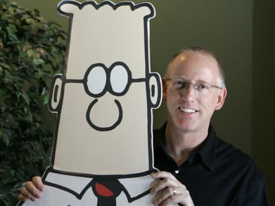 Newspapers have dropped the Dilbert cartoon after racist comments by its creator