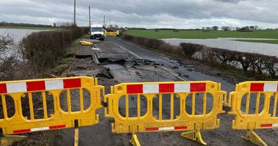 Road closed in both directions due to burst water main