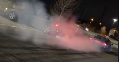 Crowds gather at Edinburgh park and ride as racers in 'modified vehicles' pull stunts