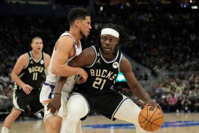 Short-handed Bucks edge Suns to push NBA win streak to 14