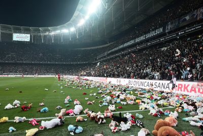 Soccer-Besiktas fans throw toys on field for children affected by earthquake
