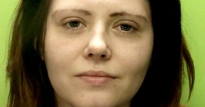 Woman spat in one police officer's face and racially abused another