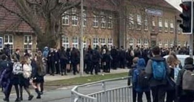 Pupils seen in 'ridiculous' queue outside school after it introduces new 'search' policy