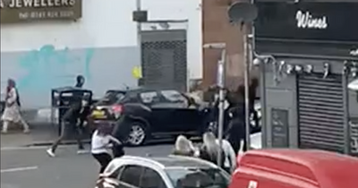 Hooded Glasgow gang pictured in mass brawl outside pub after Old Firm match