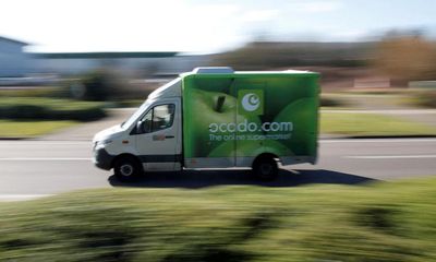 Ocado pauses building new warehouses as annual losses balloon to £500m
