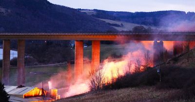 Huge explosion as fire shuts down bridge causing commuter chaos as M90 remains closed