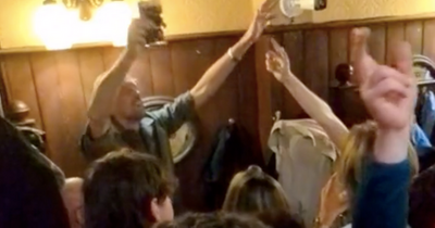 Peter Crouch belts out Fields of Athenry with Guinness in hand at famous city centre pub