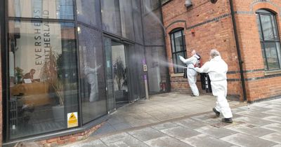 Environmental campaigners spray fake oil on offices of multinational law firm in Nottingham