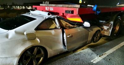 Driver's 'miracle' escape after Audi flattened under lorry in horror motorway crash