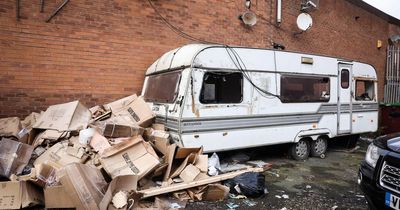 The wrecked caravan beneath a human waste pipe where a £20-a-day counterfeit street spotter may have lived