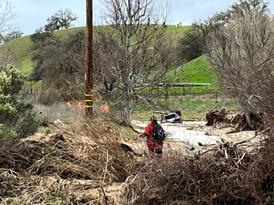 Mother pleads with police to keep searching for son swept away from SUV in floodwater