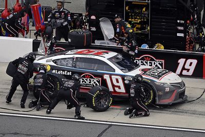 NASCAR suspends two JGR crew members after Truex loose wheel