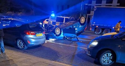 Police close Edge Lane after car overturns in crash