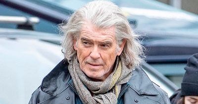 Pierce Brosnan is unrecognisable with long grey hair as he films new project