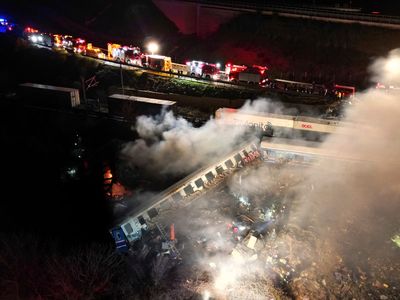 Burned carriages, mangled steel at site of Greek train crash