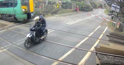 Footage captures moment moped narrowly avoided 70mph train