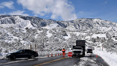 In photos: California declares emergency in 13 counties as record snowfall shuts Yosemite