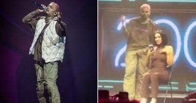 Chris Brown hurls fan's phone into crowd as he fumes over her reaction to lap dance