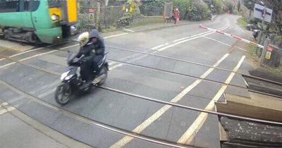 Watch as moped narrowly misses train travelling at 70mph after jumping level crossing