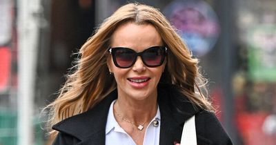 Amanda Holden goes braless in glamorous white dress and jokes it's 'obvious' she's cold