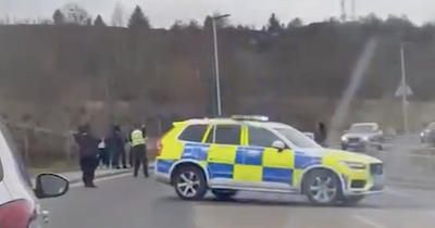 Heavily armed cops pull over car 'after chase' miles from where man killed in Greenock shooting