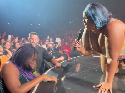 ‘I need a hug too’: Lizzo hugs crying fan in crowd at Milan show