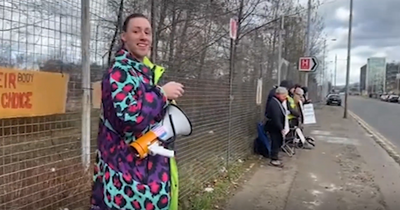 Anti-abortion protestors drowned out by feminist campaigner's cheesy pop tunes